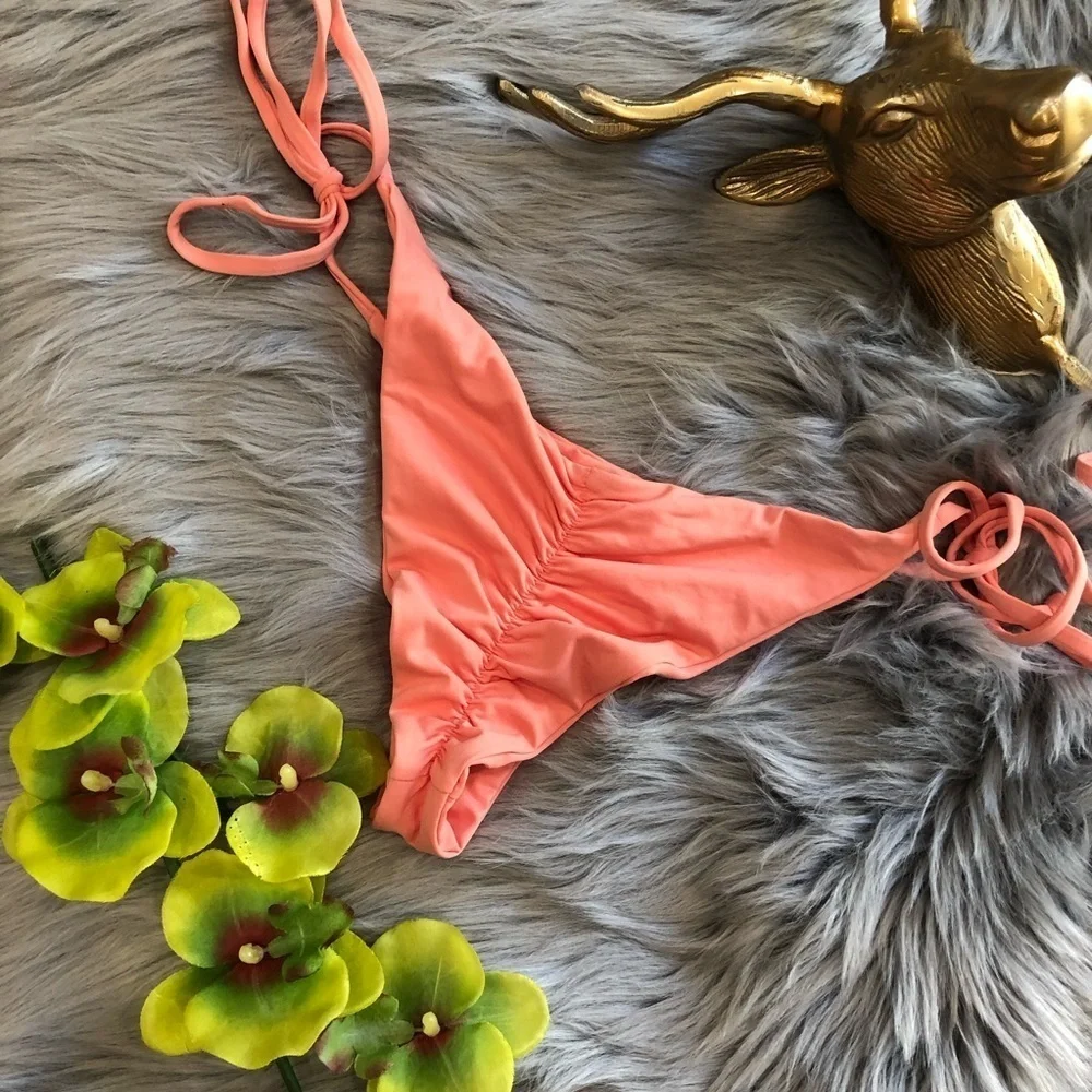 Frankie’s bikinis “Mistos” scrunch bottom in coral. Size M